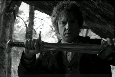 Bilbo holding a sword